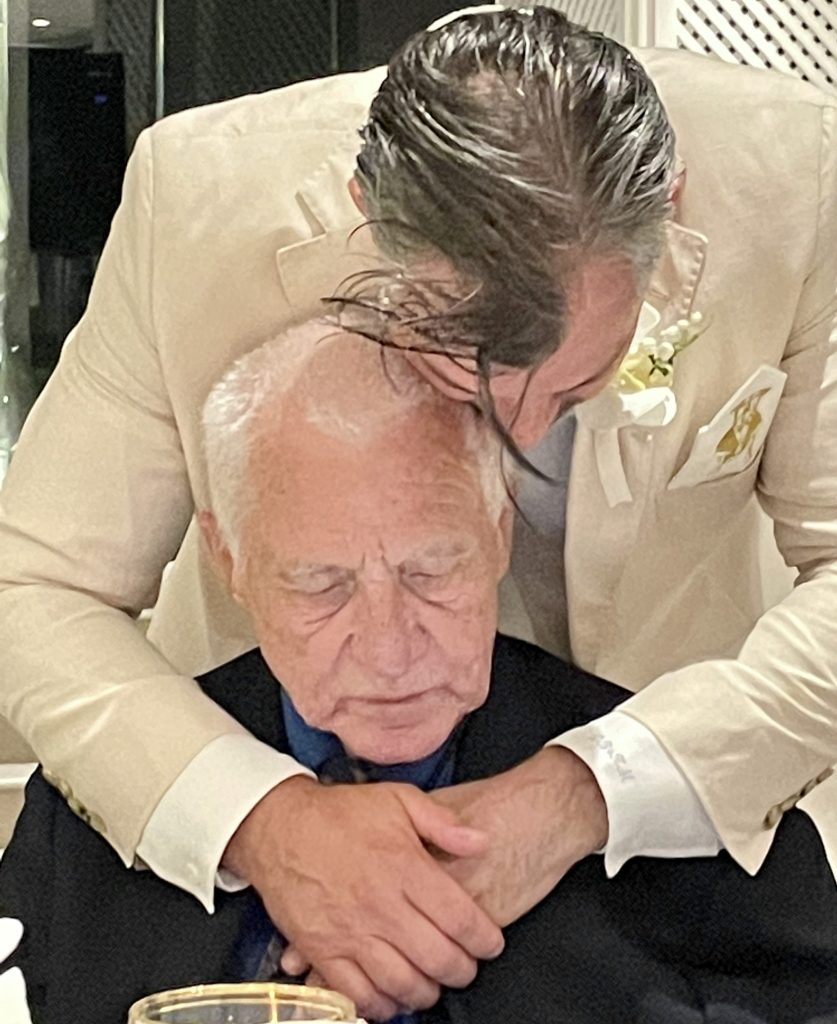 son and father at Dave's wedding in Greece